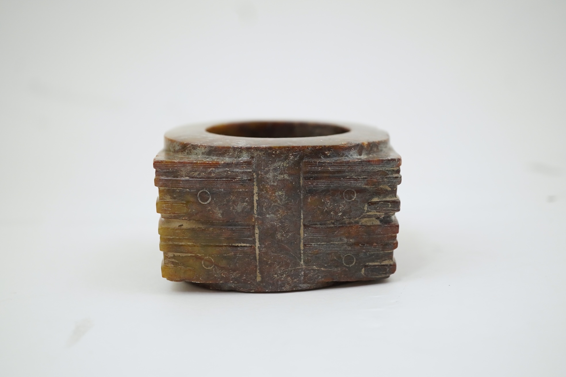 Four Chinese archaistic hardstone or burnt jade cong or cylinders